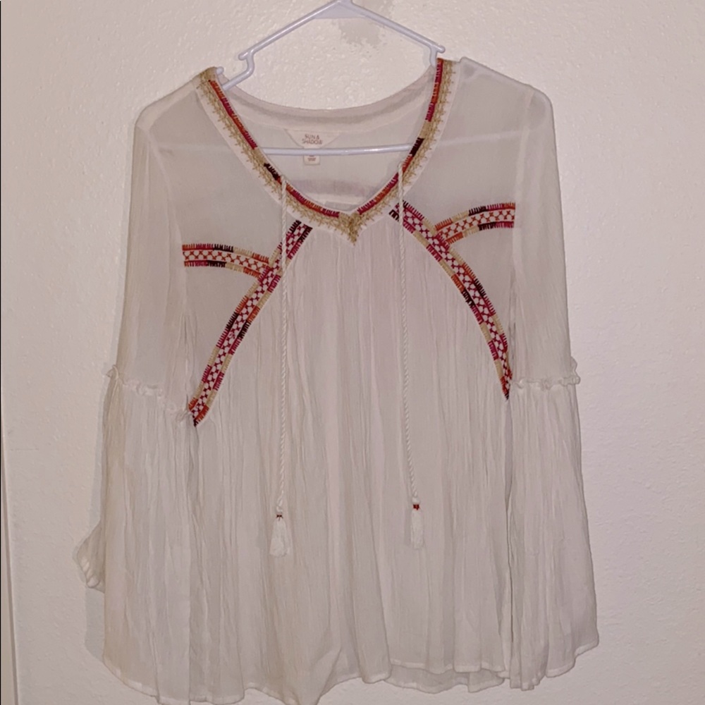 White bell sleeved top